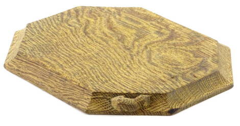 A Robert Mouseman Thompson chopping or cheese board, of canted rectangular shape, carved with typical mouse to the side, 30cm W.