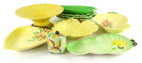 A collection of Carltonware and other leaf moulded pottery, to include yellow floral dishes, simulated basket, a green shaped leaf dish, preserve jar and cover etc.