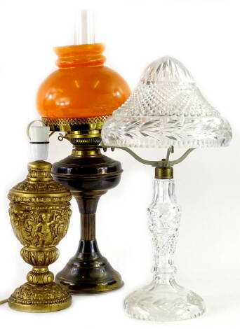 A cut glass table lamp with domed shade, 50cm H, a gilt table lamp and an oil lamp.