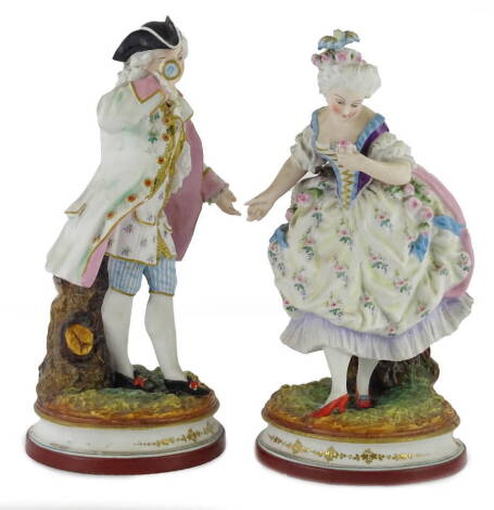 A pair of German bisque porcelain figurines, modelled in the form of a gentleman and lady, 16cm H.