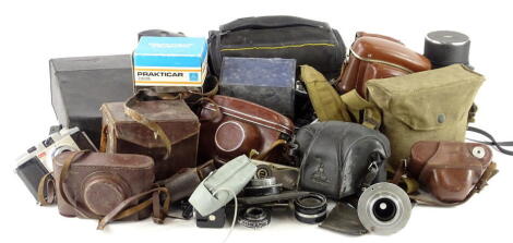 A large quantity of cameras, to include Nikon, Praktica etc.