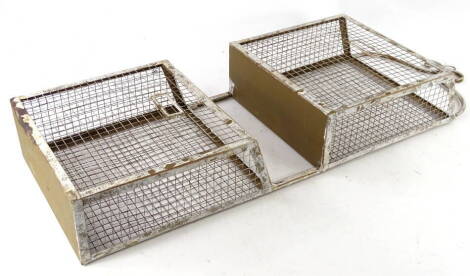 A gold and white painted mesh double magazine rack, 30cm W.