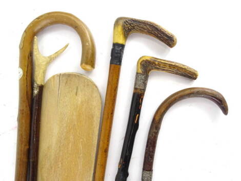 A collection of items, to include a silver mounted walking stick with antler handle, paddle etc.