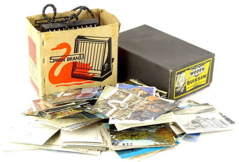 A Swan brand vintage electric toaster, and a Wolden Quick Saw both in original box, and various postcards.