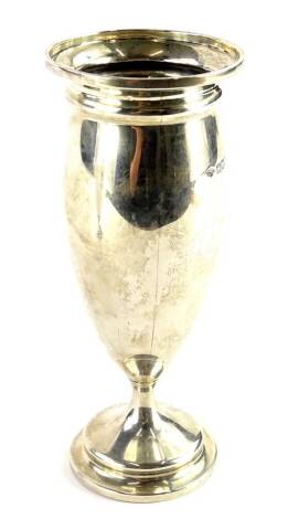 A George V silver vase, the base stamped Curtis & Horsepool Leicester, London 1912, loaded, 18cm high.