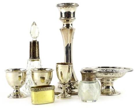 A collection of small silver, etc, to include a loaded silver candlestick, pierced small stand, egg cups, a silver gilt lid stamped Asprey, silver plated toast rack, etc.