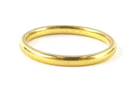 A 22ct gold wedding band, ring size M½, 2.7g all in.