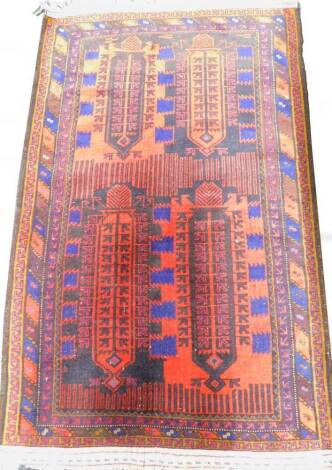 A Turkish type rug, with a geometric design, on a dark ground with various small borders, 146cm x 92cm.