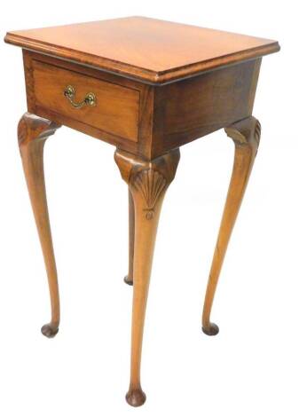 A walnut and beech urn table, the square top with a moulded edge, above a frieze drawer, on turned legs with pad feet, 36cm wide.