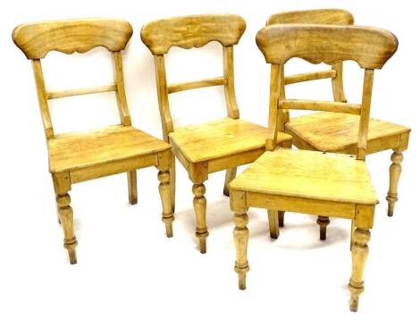 A set of four stripped beech Victorian bar back chairs, each with solid seat on turned tapering legs.