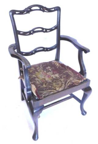 A mahogany open armchair, in George III style, with pierced ladderback, drop in seat on cabriole legs, with H stretcher.