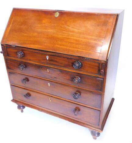 A George III mahogany bureau, the fall enclosing a fitted interior above four graduated drawers, with later turned handles and feet, 102cm wide.