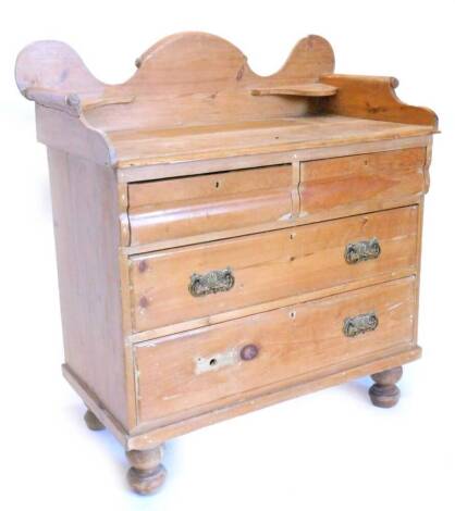 A Victorian stripped pine wash stand, with a raised and shaped back, the top with a moulded edge above two short and two long drawers, on turned feet, 89cm wide.