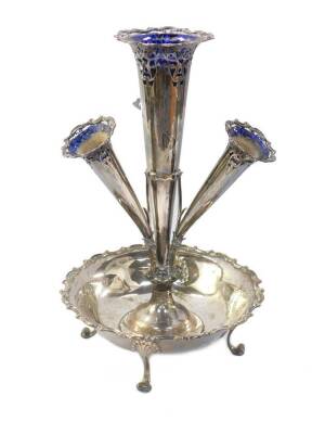 An Edward VII silver epergne, of four trumpet form, with four Bristol Blue glass flower holders, with pierced scrolling foliate decoration, raised on a circular bowl with a gadrooned rococo C scroll rim, raised on four scroll feet, William Hutton & Sons L - 2