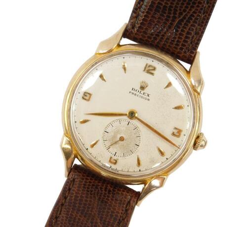 A Rolex precision gentleman's 9ct gold cased wristwatch, circa 1950's, the dial bearing gold batons and arabic numerals at quarters, subsidiary seconds dial, 17 jewel movement, number 65183, case number 172/4636, on a leather strap.