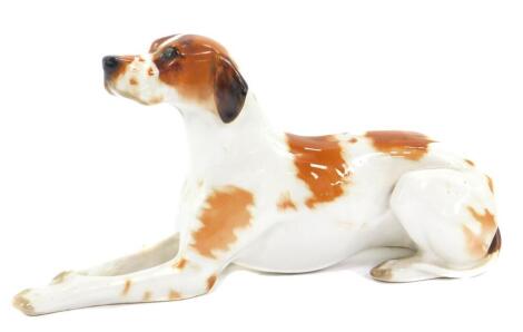 A Lomonosov porcelain figure of a pointer dog, modelled in recumbent pose, printed mark, 30cm L.