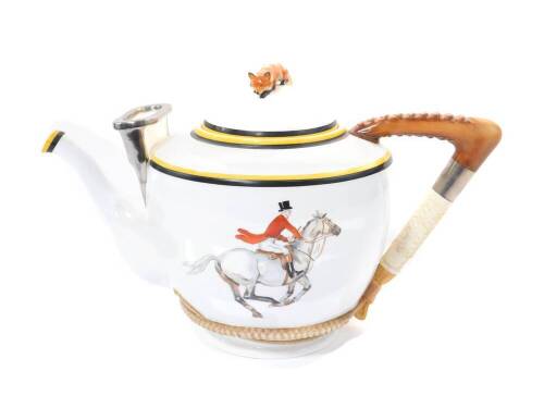 A Royal Worcester mammoth teapot, the lid with fox finial, riding crop handle, painted with a huntsman on horseback, and a huntswoman and butler, printed mark, 40cm W, 26cm H.