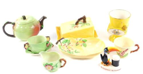 A group of Carlton ware pottery, including an apple shaped teapot, My Goodness My Guinness Toucan, and leaf moulded wares. (qty)