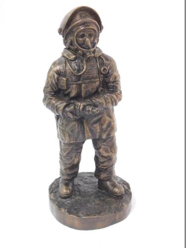 A late 20thC bronzed plaster figure modelled as a fire fighter, raised on a circular base, limited edition 103/500, initialled AGD, dated '97, 25.5cm H.