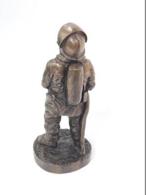 A late 20thC bronzed plaster figure modelled as a fire fighter, raised on a circular base, limited edition 103/500, initialled AGD, dated '97, 25.5cm H. - 2