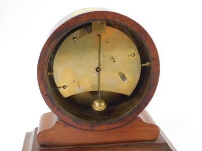 A French late 19thC walnut cased mantel clock, the circular enamel dial bearing Roman numerals, the case of barrel form, raised on a rectangular plinth, no key, 15cm W, 7.5cm D, 16.5cm H. - 2