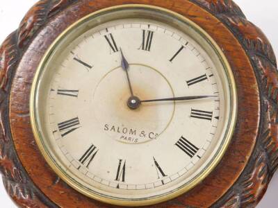 A French early 20thC oak cased wall clock and matching barometer, by Salom & Co Paris, silvered dials, the case with rope twist carving, with key, 14.5cm D. (2). - 2