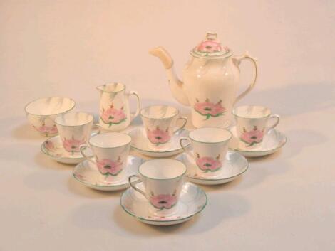 A Collingwood bone china coffee service painted with water lilies in pink