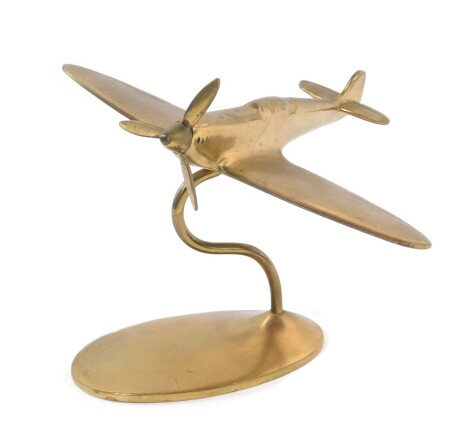 A brass desk stand modelled as a spitfire, 18.5cm W.