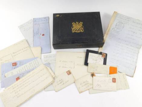 A 19thC black Morocco deed box, embossed with a gilt Royal Coat of Arms and Prince of Wales feathers, containing 18thC and later legal documents and letters, including George III court summonses, a George II bond, a letter to the Earl Brownlow and a Bill