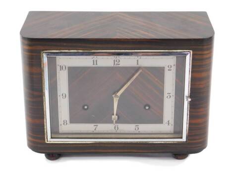 A Bentima Art Deco coromandel cased mantel clock, the rectangular dial with silvered chapter ring bearing Arabic numerals, HAC eight day movement with Westminster chimes, the case of bow fronted form, raised on bun feet, with key, 30cm W, 13.5cm D, 21.5cm