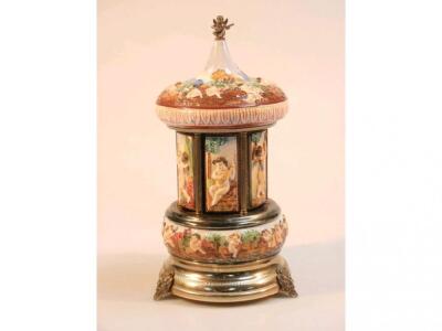 A modern Naples style porcelain and gilt metal musical cigarette dispenser