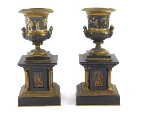 A pair of late 19thC marble and gilt brass clock garniture urns, of neoclassical Campana form, raised on rectangular plinths supported by Corinthian columns flanking figural panels, 10.5cm W, 8.5cm D, 22.5cm H.