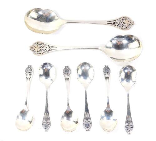 A George V silver fruit set, with pierced floral terminals, comprising two large and six small spoons, Sheffield 1932, 12.31oz.