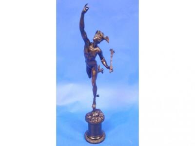 A Giambologna bronze figure of Mercury raised on a cylindrical base