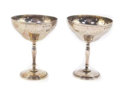 A pair of silver goblets, engraved with floral swags, Birmingham 1970, 9.19oz.