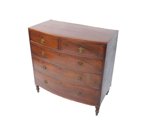 A George III mahogany bow front chest of drawers, with two short over three long graduated drawers raised on turned legs, 90cm H, 91cm W, 50.5cm D,