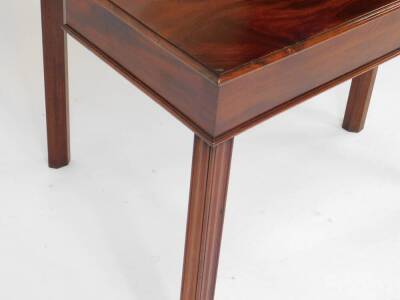 A George III mahogany fold over tea table, raised on fluted square legs, 73cm H, 92cm W, 42.5cm D. - 4