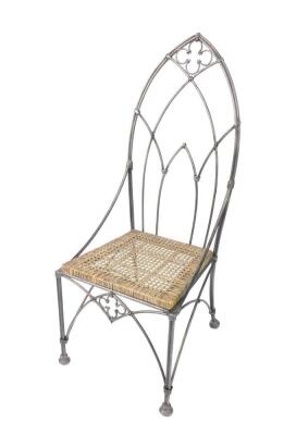 A wrought iron Roman style window seat, of curved form with scrolling arms, 124cm W, together with a wrought iron Gothic throne chair, with a cane seat, raised on double column legs, 125cm H. (2) - 2