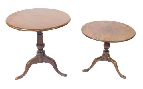 A George III and later tilt top occasional table, the circular top raised on a bird cage and baluster turned column, over three cabriole legs, 69.5cm H, 69.5cm Dia, together with a further mahogany tilt top occasional table, raised on a baluster turned co