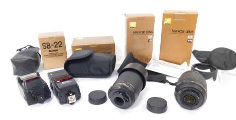 A Nikon Nikkor DX digital lens, AF-S DX - 18 - 105mm S/3.5-5.6G ED VR, a further lens, AF-S DX-VR - Zoom 55-200mm F/4-5.6G IF-ED, an SB-600 speed light, and a SB-22 speed light, all boxed. (4)