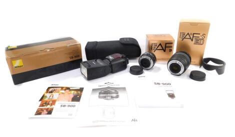 A Nikon FAFG-SED zoom lens, 24-85mm F/3.5-4.5G (IF), a 28mm lens S/2.8D, and an SB9-900 speed light, all boxed. (3)