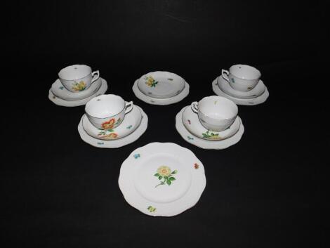 A Herend porcelain part tea service, painted with flowers and floral sprigs, comprising four tea cups, five saucers and six tea plates (AF).