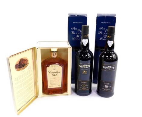 A bottle of Canadian Club whisky, aged 15 years, 750ml, cased, together with two bottles of Blandy's Madeira, aged 10 years, boxed (3).