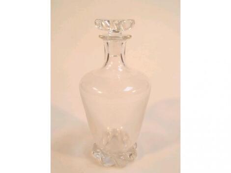 A Daum decanter with fine reeded decoration to the body with a fluted stopper