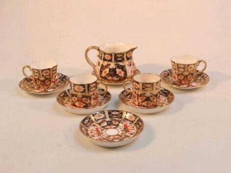 A Royal Crown Derby old Imari patterned part coffee set comprising two coffee cans