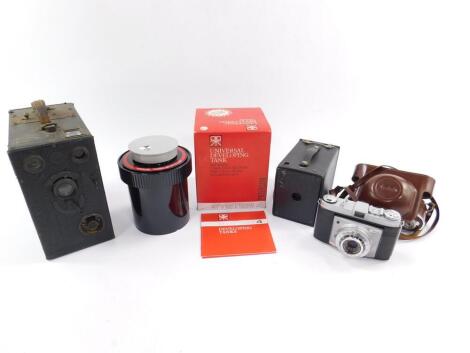 A Kodak Retinette camera, No.2 Brownie camera, a Midg No.4 camera, and a Paterson universal developing tank, boxed. (4)