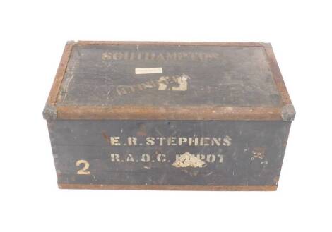 A military black painted and iron bound military chest, painted to the lid with H T Dunera, Southampton, to the front with E R Stephens, RAOC Depot, 39cm H, 85cm W, 47cm D.