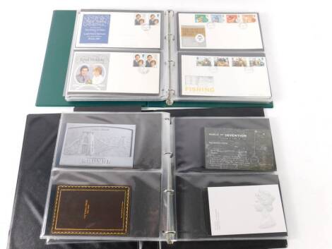 Philately. QEII commemorative mint stamps, and first day covers in two albums.