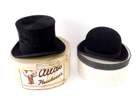 A black silk top hat, size 6 3/4, boxed, together with a Billings & Edenhams Ltd bowler hat. (2)