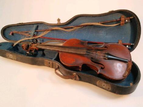 A 19thC violin with two piece figured back and ebony pegs